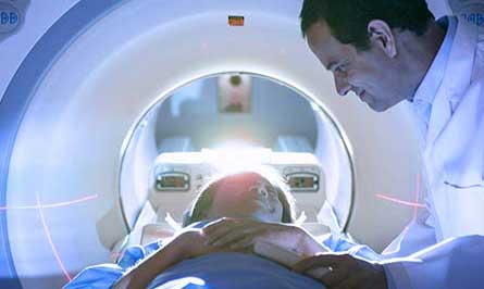 Patient in medical scanner with doctor